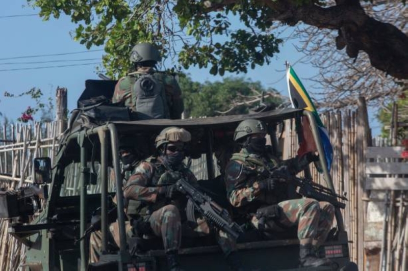 A military convoy of South Africa National Defence Forces (SANDF) rides along a dirt road in the Maringanha district in Pemba on August 5, 2021 PIC: Alfredo Zuniga / AFP) (Photo by ALFREDO ZUNIGA/AFP via Getty Images