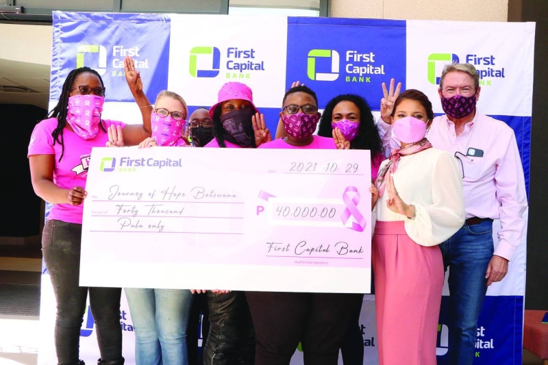 First Capital and JOH staff at the cheque handover ceremony PIC: MORERI SEJAKGOMO