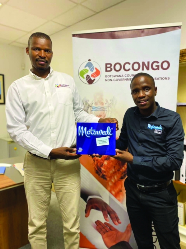 Motswedi Board Game inventor Thabiso Titus Paul (black shirt)