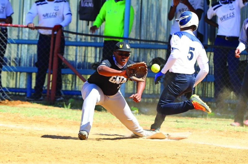 ENTERTAINING ENCOUNTER: Gatalamotho and Wells battling it out during the Softball Independence Cup eminations on Saturday PIC: KENNEDY RAMOKONE
