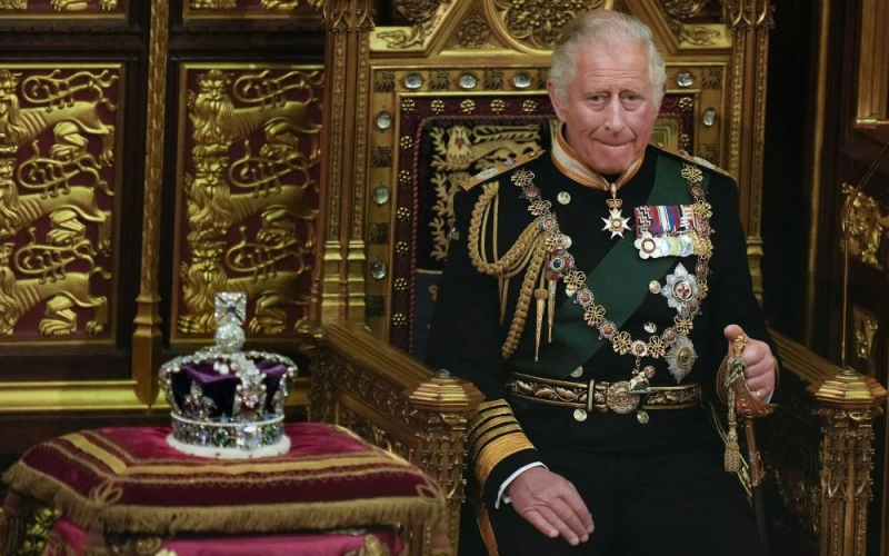 FILE - Prince Charles is seated next to the Queen's crown during the State Opening of Parliament, at the Palace of Westminster in London, May 10, 2022. Queen Elizabeth II did not attend the opening of Parliament amid ongoing mobility issues. Prince Charles has been preparing for the crown his entire life. Now, that moment has finally arrived. Charles, the oldest person to ever assume the British throne, became king on Thursday Sept. 8, 2022, following the death of his mother, Queen Elizabeth II. (AP Photo/Alastair Grant, Pool, File)