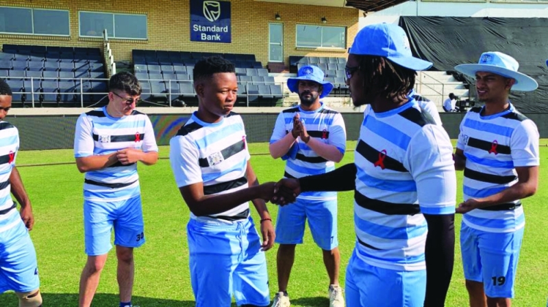 First cap: Maphane, a product of BCA development programme, receives his cap from captain Motlhanka