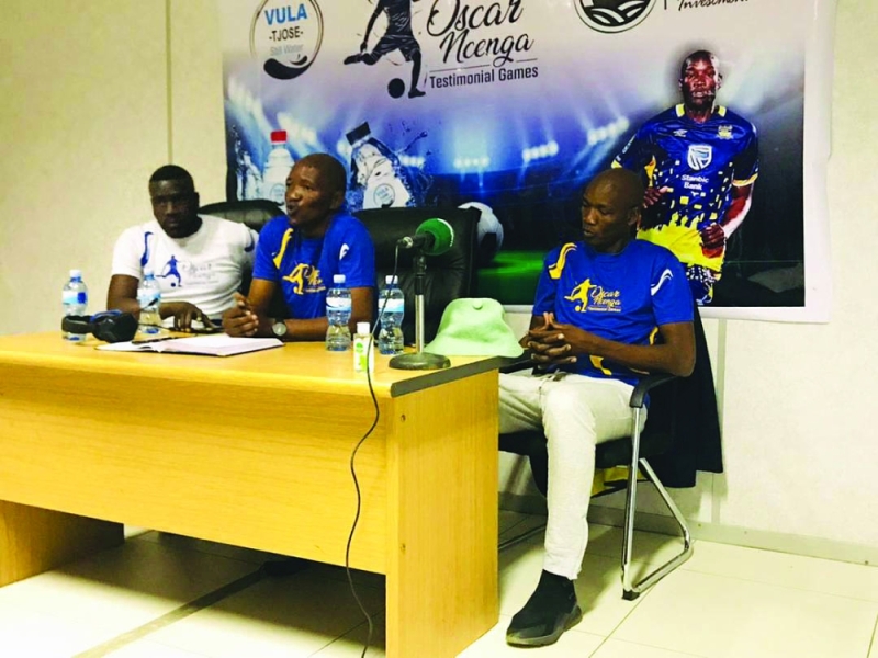 Recuperating:
Ncenga (right) at
the press briefing