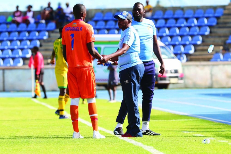 Well done: Maphakela with head coach Motang and goalkeeper coach David Puso PIC: PHATSIMO KAPENG
