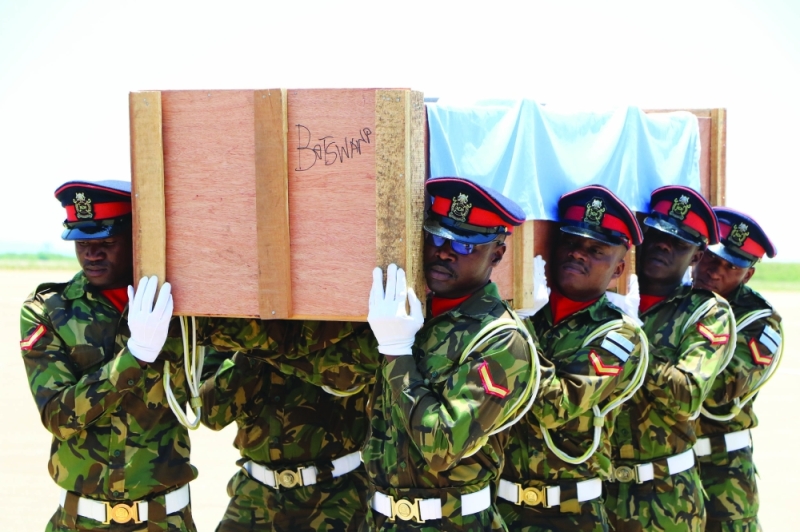 Solders carrying the body of Lance Corporal Kamal who died in Mozambique PIC: PHATSIMO KAPENG