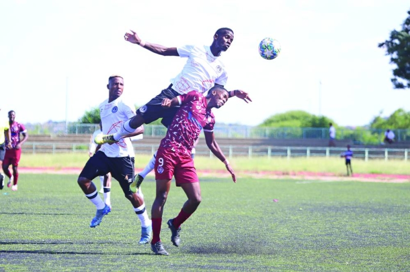 Flying Ostrich: Tapiwa Nyamanjiva leaps above Holy Ghost's Lesley Ramaphane during yesterday's encounter PIC: KENNEDY RAMOKONE