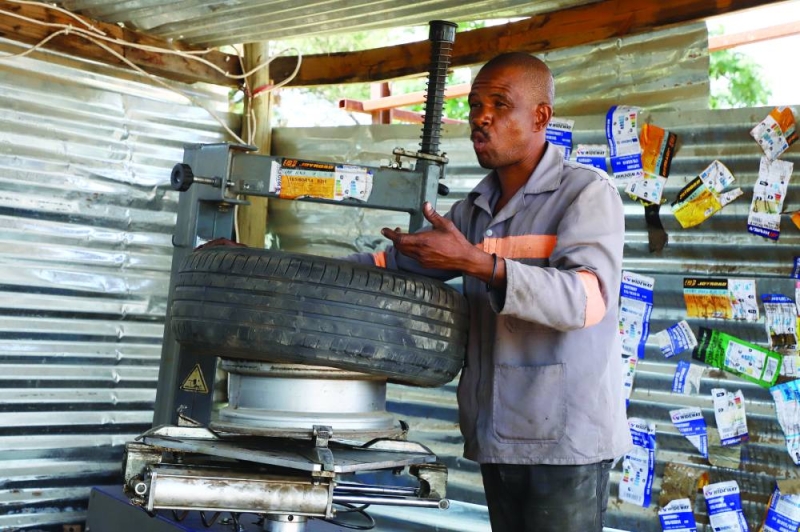 Aobakwe Hirchfeld patching a tyre. PIC MORERI SEJAKGOMO