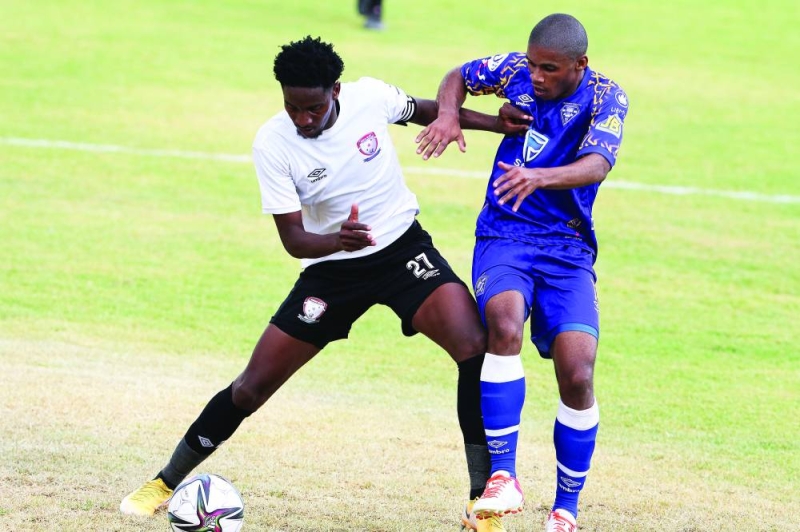 Tough duel: Thabo Leinanyane (left) against Tlhalefo Molebatsi PIC: KENNEDY RAMOKONE