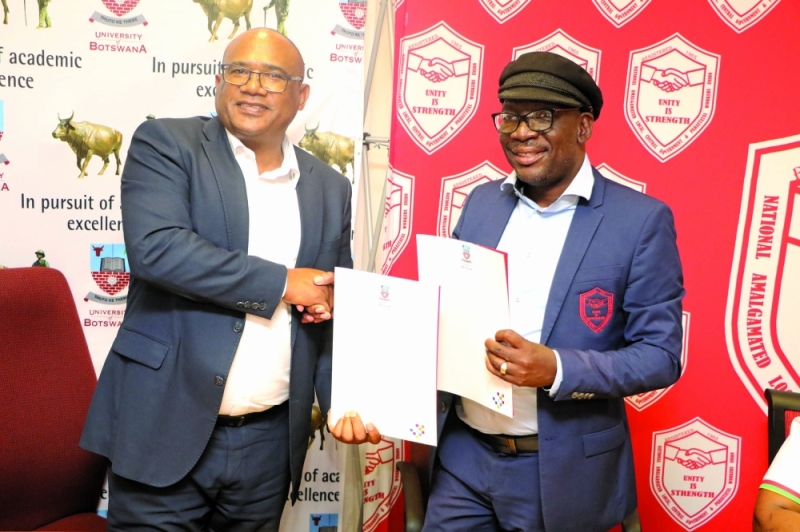 UB Vice Chacellor Norris and Manual Workers Union chief negotiator Rabasimane during signing of the agreement PIC: PHATSIMO KAPENG
