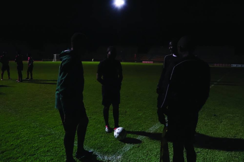Referees consulting each other after floodlights went off at Lobatse Sports Complex PIC: MORERI SEJAKGOMO
