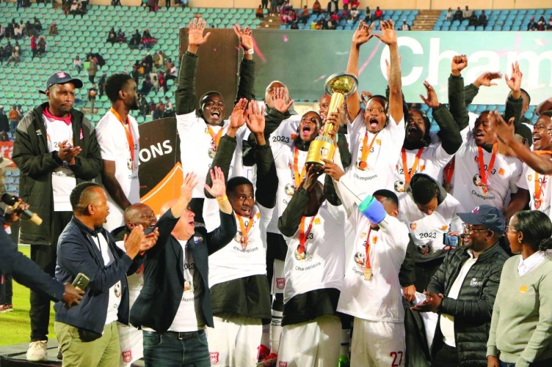 GU lifting Orange FA Cup trophy PIC: PHATSIMO KAPENG