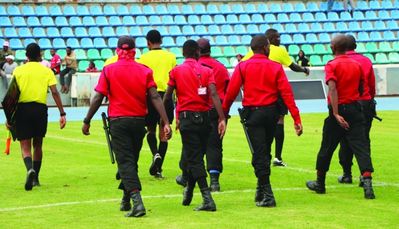 On duty: Referees being escorted off the pitch during a league match PIC: PHATSIMO KAPENG