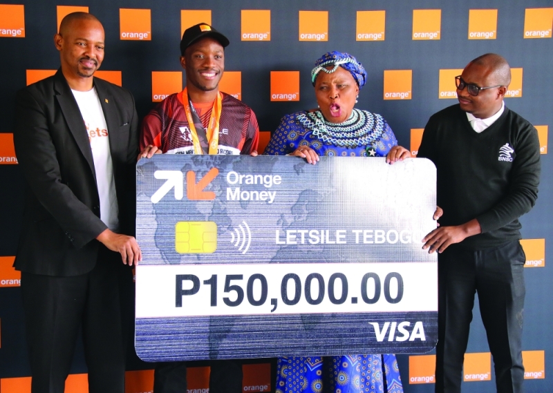 Happily ever after: Tebogo (second left) receives a cheque from Orange Botswana PIC: PHATSIMO KAPENG