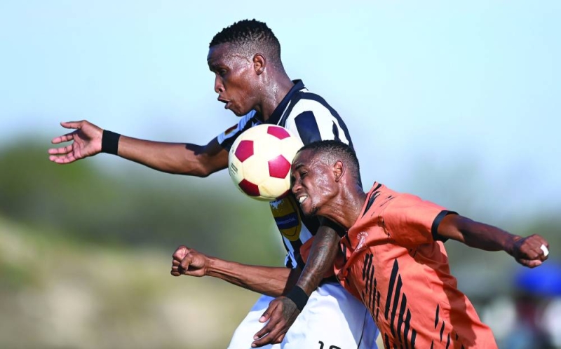 Mochudi Centre Chiefs (in white) battled with City Polar in the Debswana First Division South league encounter played in Ramonaka on Saturday PIC: MONIRUL BHUIYAN.PRESS PHOTO