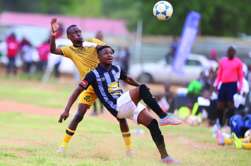 Thabang Ofitlhile (Yellow) of Notwane battles for the ball against Bakang Leshona (Black) of Mochudi Centre Chiefs PIC: KENNEDY RMOKONE