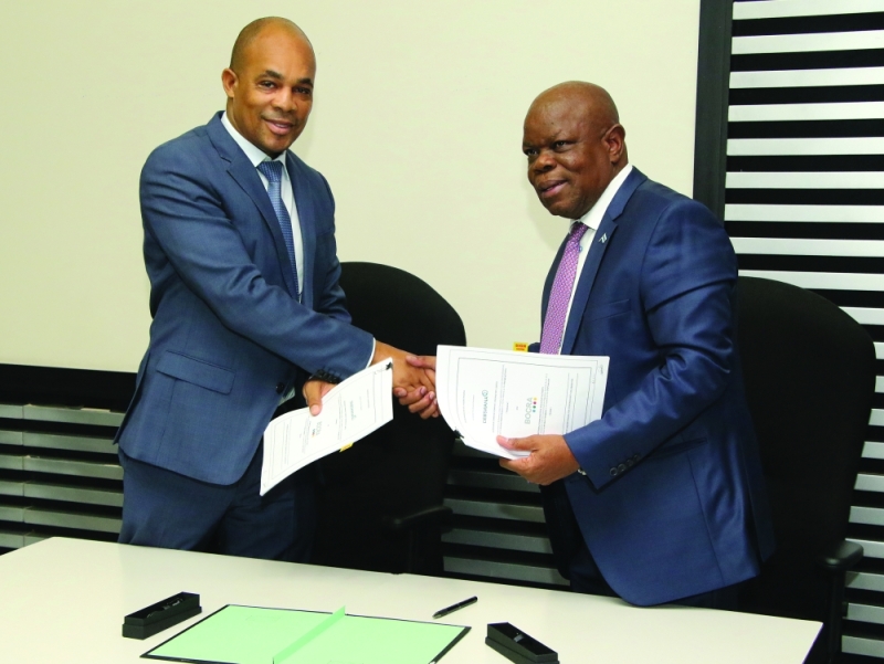 Ink to paper: Mokgware and Motsomi signing the agreement on Tuesday PIC: PHATSIMO KAPENG