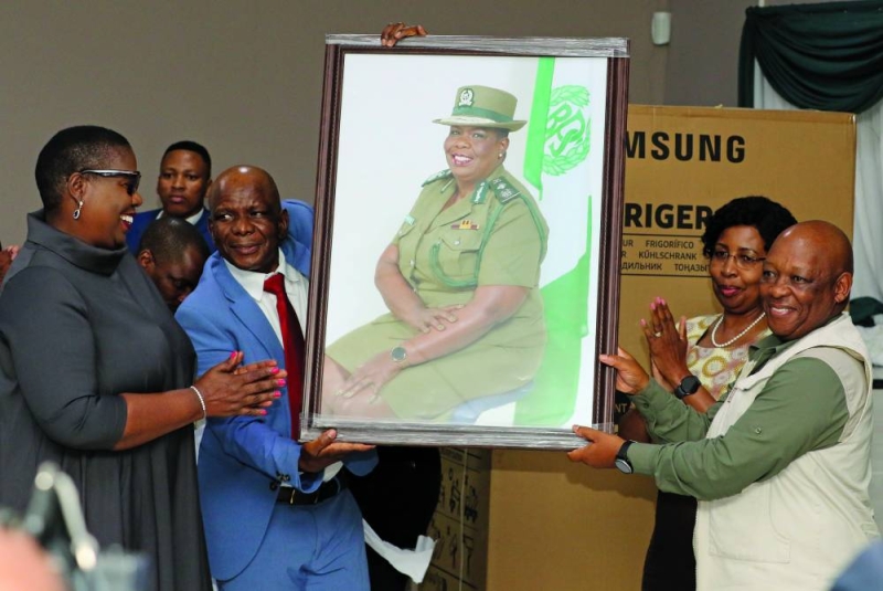 Dinah Marathe recieving gifts PIC: PHATSIMO KAPENG