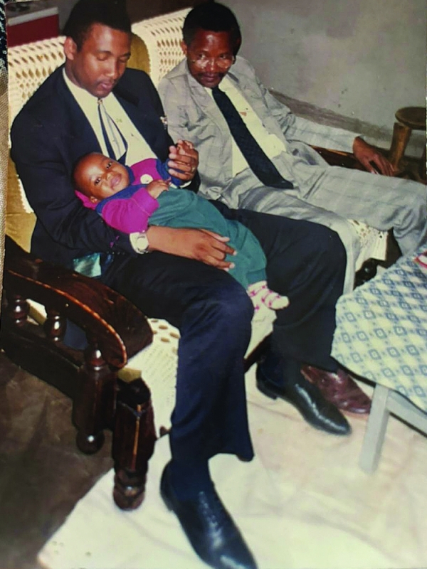 Duma (holding his nephew) and father Steve