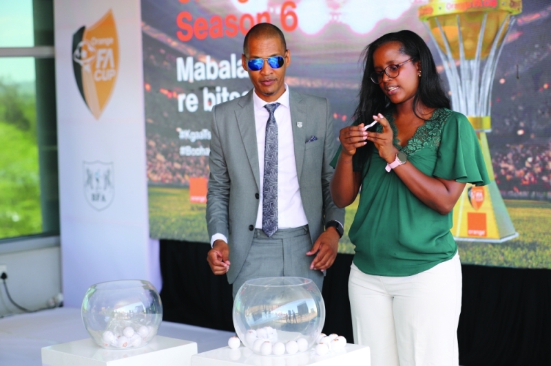 Orange FA cup last 48 draw being done by BFA president, Babitseng and Orange Botswana CEO, Maïga PIC: KENNEDY RAMOKONE
