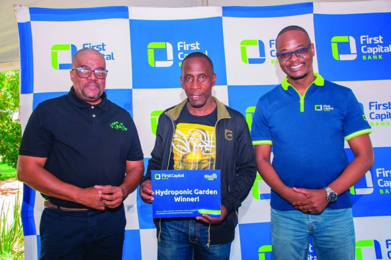 Winner: David Ananius, the winner of Hydroponic, with First Capital Bank representatives