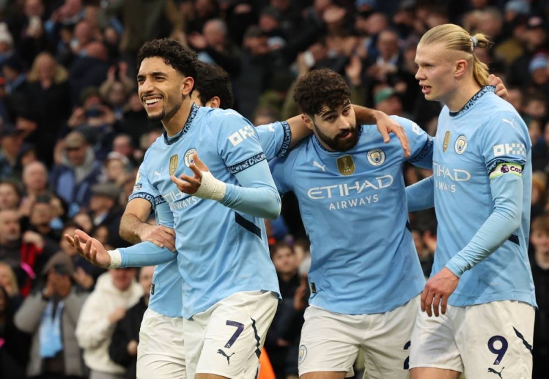 epa11898385 Omar Marmoush of Manchester City (L) celebrates with teammates after scoring the 3-0 goal during the English Premier League match between Manchester City and Newcastle United, in Manchester, Britain, 15 February 2025. EPA/ADAM VAUGHAN EDITORIAL USE ONLY. No use with unauthorized audio, video, data, fixture lists, club/league logos, 'live' services or NFTs. Online in-match use limited to 120 images, no video emulation. No use in betting, games or single club/league/player publications.