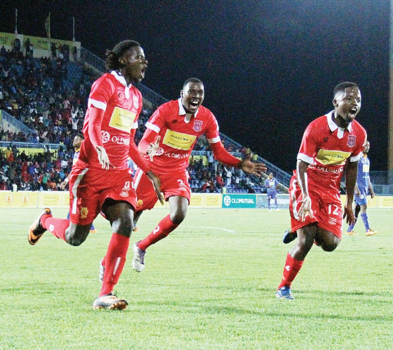 Unbridled joy: GU players celebrate after Benson Shilongo tucked away the winning penalty. PIC: MORERI SEJAKGOMO