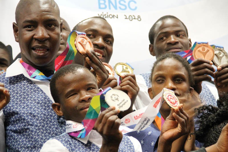 Special olympians holding their medal.Pic.Kagiso Onkatswitse