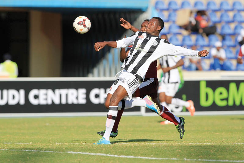 Charles Mutero (White) of Mochudi Centre Chiefs against Umar Ngobi.PIC.KENNEDY RAMOKONE