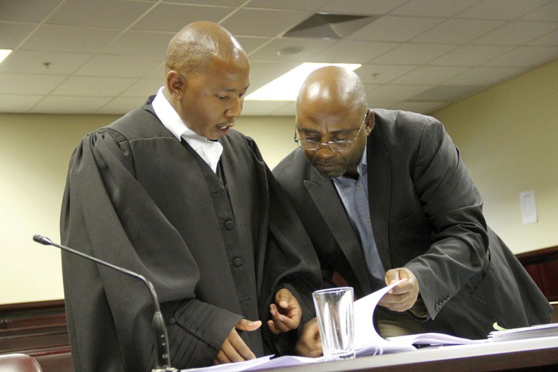 Letlole chatting with his client Makosha