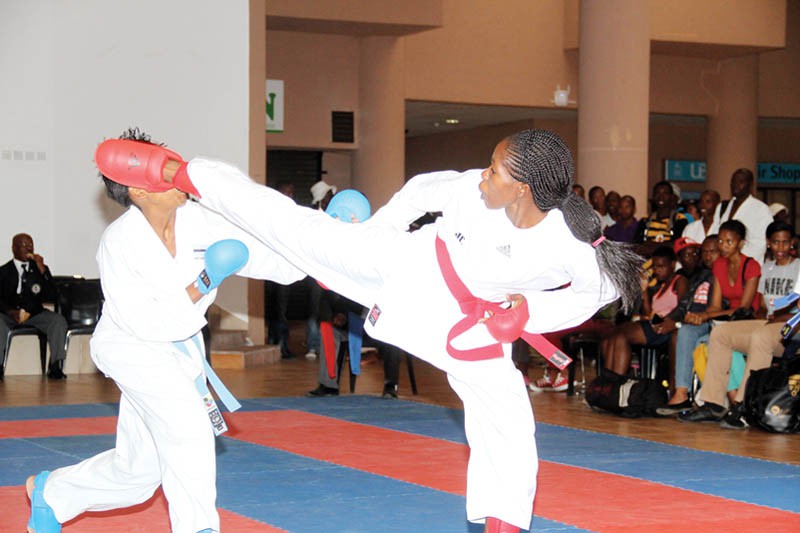 Off the mark: Thato Malunga (in red) sends a kick to opponent Baone Radiposo during BOKA's first tournament of the year on Saturday. PIC: KABO MPAETONA
