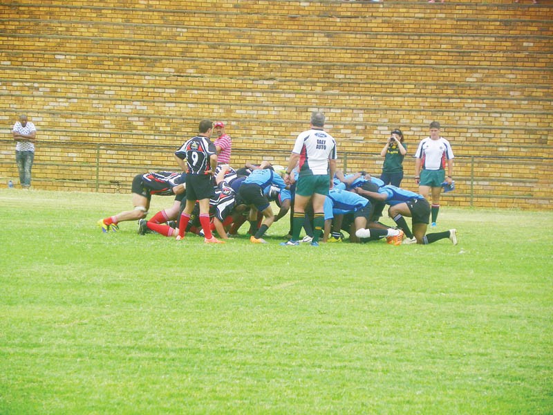 Greener pasturers: Jaguars (in blue) battle it out against Zeerust Rugby Club in South Africa over the weekend