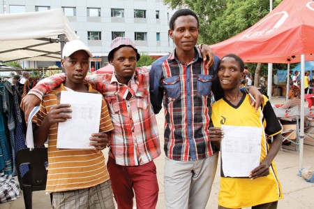 Helping hand: James and some of the children he is assisting. PIC: MORERI SEJAKGOMO