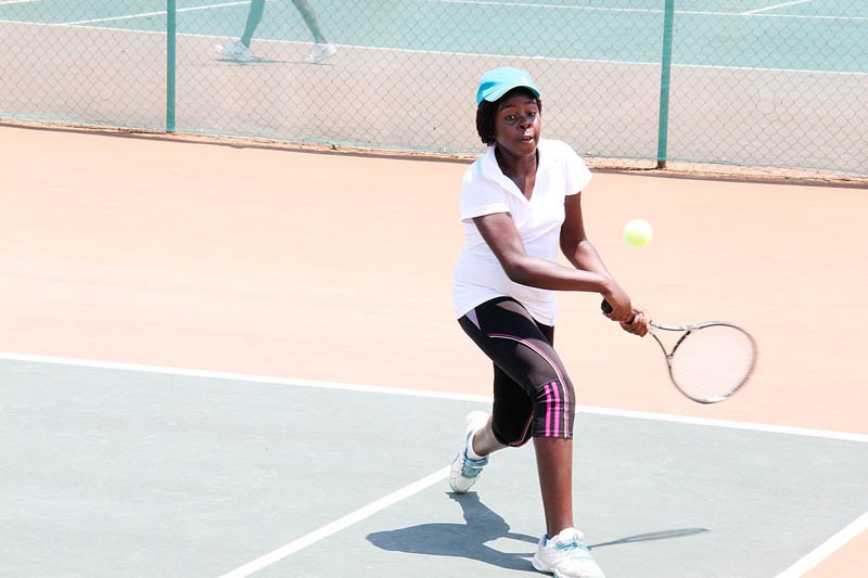 Blossoming talent: Under 12 player, Segomotso Sibanda plays a return against Mozambique opponent Anna Vasilis during the second round of the CAT/ ITF Southern Africa Champions at the Notwane Tennis Courts in Gaborone yesterday. PIC KEBOFHE MATHE