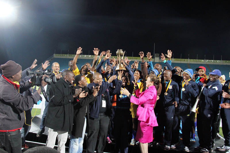 Township Rollers players and officials celebrate after successfully defending the Kabelo Charity Cup on Saturday