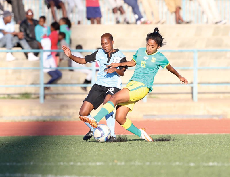 Botswana's Banyana Tshekiso(left) battling for the ball with South Africa's Thaleo Smidt. PIC: KAGISO ONKATSWTSE