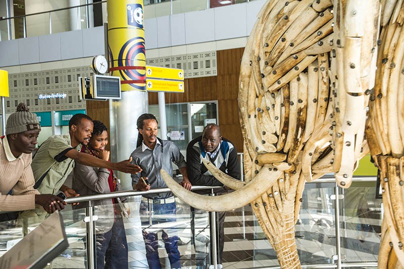 Artists admiring their sculpture