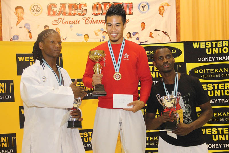 Hong Kong's LEE KA YWAI, Botswana's China Mitswi and Carlos Dambe at Gaborone Open Karate Championship. PIC: KENNEDY RAMOKONE