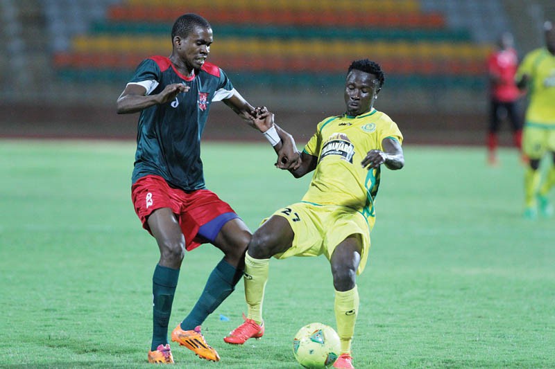 BDF XI's Mosha Gaolaolwe with Young Africans' Saimon Mvusa. PIC: MORERI SEJAKGOMO
