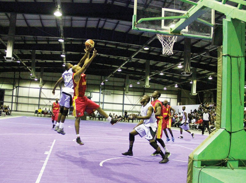 Botswana's Emmanuel Ramoshebi (in blue) fights for the ball with Stelio Nuaila of Mozambique. PIC: KAGISO ONKATSWITSE
