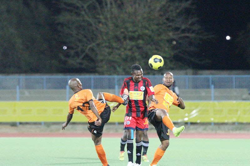 Gilport Lions' Sekgabo Molebatsi (left) and his teammate, kenamile Mani close down Chiefs' speedy winger, Ayanda Molefe