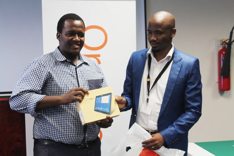 Mabedi Motimedi receives the award on behalf of the overall winner who was not at the event