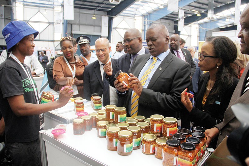 Gobal Expo: Vice President Mokgweetsi at Lesedi Seumakwane's stall who was funded under Nyeletso lehuma programme. PIC: KABO MPAETONA