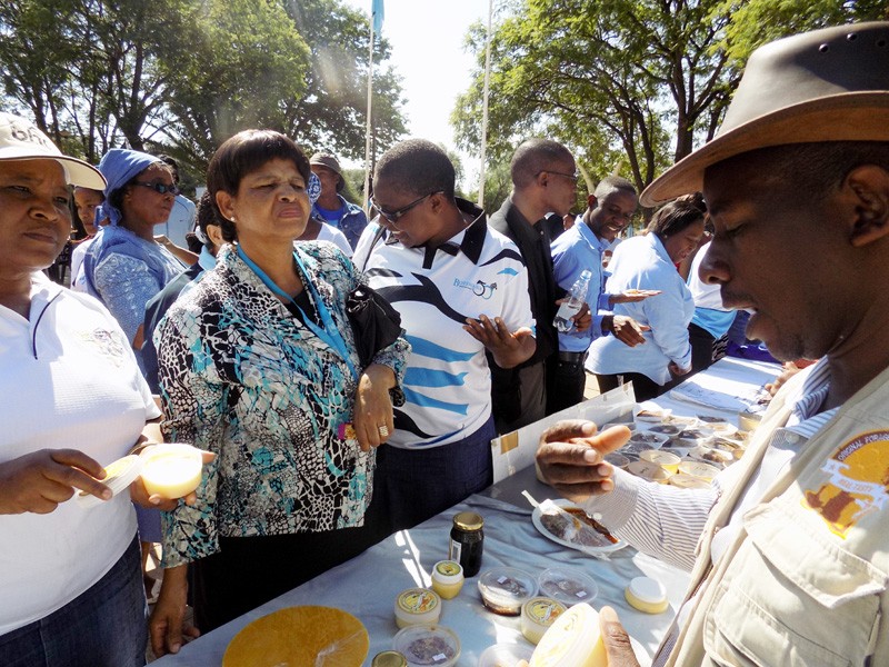 Serefete Ramantsima (right) showing some of his products to potential clients