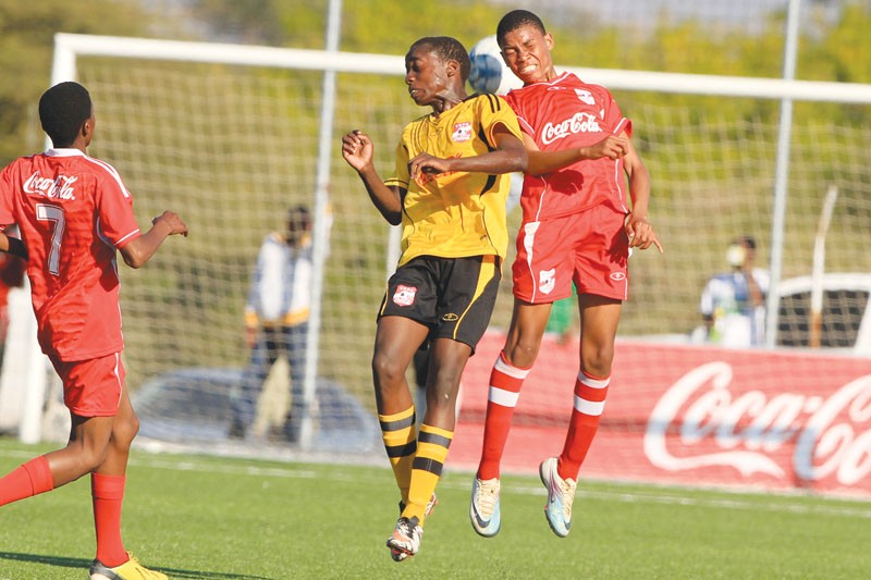 Bakang Kenaope (Red) of Marang JSS against Kago Mosalagae during Copa Coca Cola competitions.PIC: KENNEDY RAMOKONE
