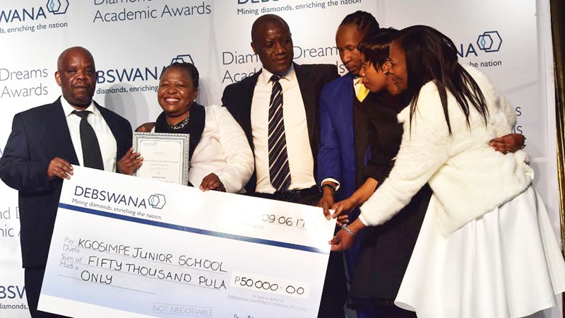 Kgosi Malope II handling over the cheque PIC: LEBOGANG BAINGAPI