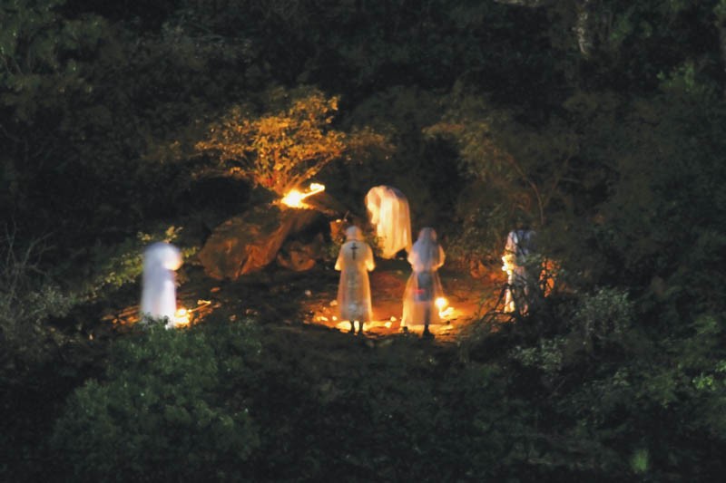 CHURCH members praying on the hilltop at night PIC: THALEFANG CHARLES