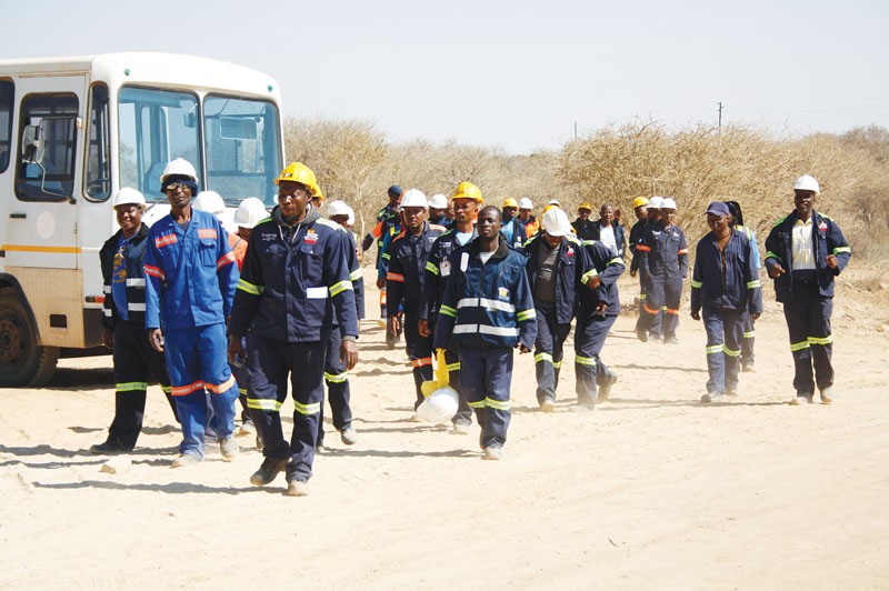 Workers gather outside Masama mine on Mondais. PIC: Phatsimo Kapeng