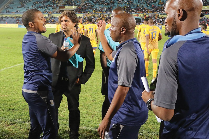 Officials put their heads together at the end of the extra time as confusion reigned PIC: KENNEDY RAMOKONE