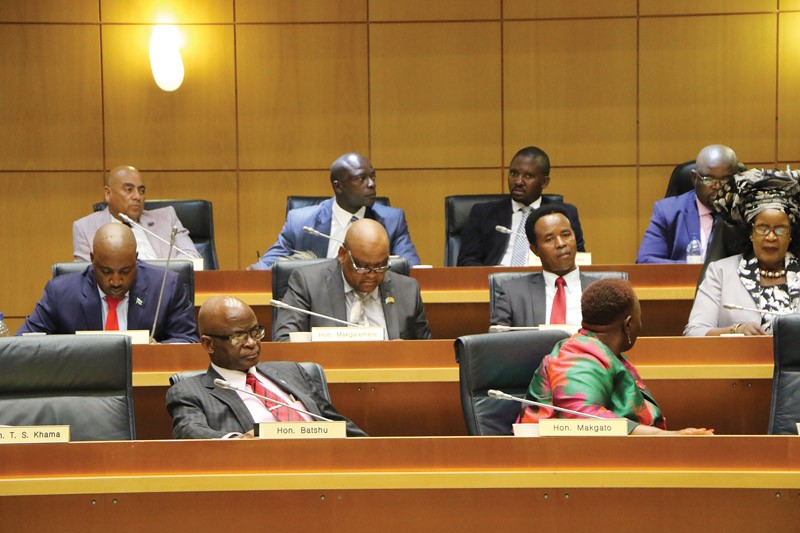 Legislators listening to proceedings in Parliament