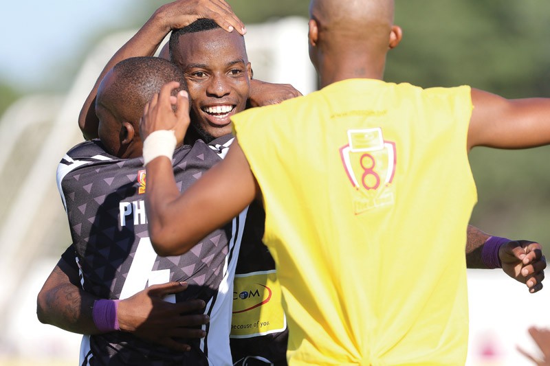 Thero Setsile celebrating his goal with team mates PIC: KENNEDY RAMOKONE